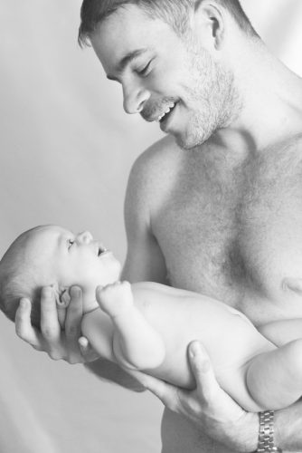 happy daddy with newborn baby